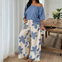 Ensemble décontracté 2 pièces pour femme : haut à col rond et manches courtes, épaules dénudées, associé à un pantalon large à imprimé floral, tenue confortable et ample