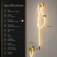Applique murale LED moderne en fer doré avec design en boucle de silicone tressée pour la décoration d'appartements, de salons, de chambres et de couloirs