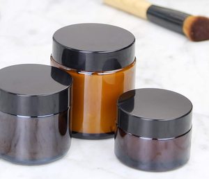 1oz 30g Customized amber cream glass jar with black plastic lid and label