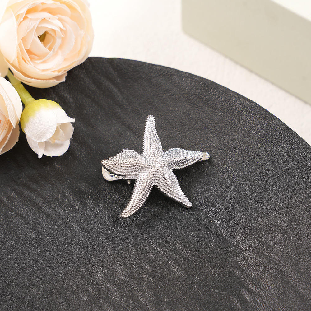 Silver starfish duckbill clip