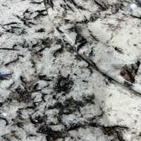 Table à manger ronde en marbre Luca Patagonia avec plateau tournant |   Colonne cannelée en marbre veiné noir poli, sur mesure pour villa et hôtel