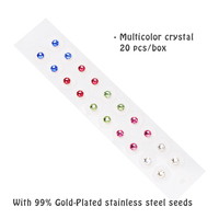 Graines d'oreille adhésives transparentes de couleur chakra pour l'auriculothérapie avec cristal d'acupuncture