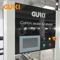 Scelleuse de cartons électrique automatique GURKI GPETB-40 avec étiqueteuse en temps réel pour l'emballage de vêtements et de matériaux en bois