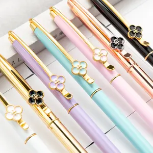 Nouveauté cadeau stylos à bille trèfle LOGO personnalisé stylo à bille en métal or rose avec fleur sur clip