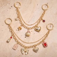 Chaîne de breloques pour chaussures au design exclusif, personnalisable en gros, plaqué or, avec strass rouges, motifs nœud et fleur, inspirée du maquillage et du rouge à lèvres