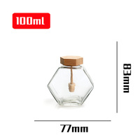 Pot de stockage d'abeilles en verre de forme hexagonale en gros d'usine 180ml 220ml 380ml avec louche en bois