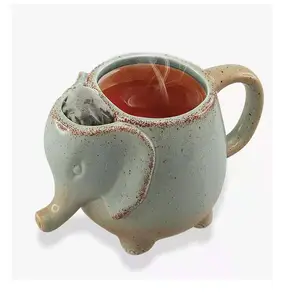 Tazza promozionale della tazza di caffè del tè di ceramica animale di forma dell'elefante 3D con il cucchiaio