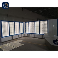 Unité d'affichage interactive pour téléphones mobiles en usine, présentoir en verre pour démonstration pratique, support de charge sécurisé avec verrouillage