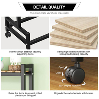 Support de plantes mobile à 2 niveaux avec roulettes, structure métallique, étagères en bois carbonisé pour la maison, le jardin et l'affichage de pots de fleurs – Vente directe usine