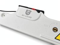 Système de verrouillage au sol pour porte à enroulement électrique avec commande de puissance du moteur et alarme sonore et visuelle