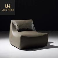 Mobilier de salon italien moderne et léger et luxueux Chaise longue de loisirs en cuir avec repose-pieds