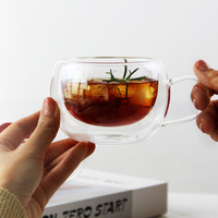 Tasses en verre borosilicate à double paroi de forme ronde avec poignées pour le thé ou le café, résistantes à la chaleur et anti-brûlure