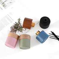 Diffuseurs de parfum en verre rond de luxe 100 ml 120 ml transparent/givré/noir avec bâtonnets et couvercle en bambou naturel