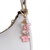 Porte-clés en métal pour femme, motif fleurs colorées et nœuds, avec perles et papillons, tendance et personnalisé, vente en gros