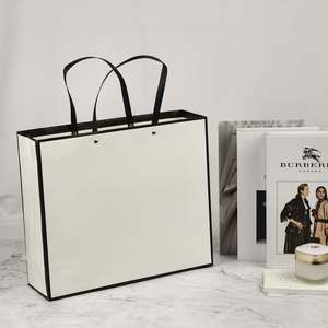 Sacs d'emballage pour montres et bijoux en papier blanc de luxe avec logo personnalisé USM, avec poignée en ruban, imprimés en UV en relief, recyclables - Product Image 2