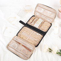 Organisateur de bijoux de voyage pliable, étui portable pour boucles d'oreilles et bagues avec fenêtres transparentes, fermeture éclair, noir