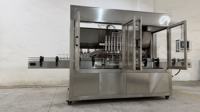 Machine de remplissage automatique de liquides haute précision pour le miel, le beurre de cacahuète et les boissons - Remplissage de bouteilles en verre multi-matériaux