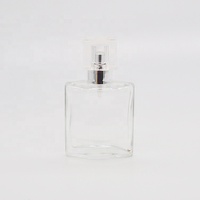 Flacon de parfum vide personnalisé OEM/ODM de 30ml/100ml en verre transparent rectangulaire au design spécial avec pulvérisateur à pompe