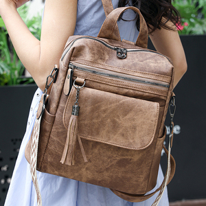 Sac à dos vintage personnalisé pour femme en cuir PU, multi-poches, fermeture éclair, sac à dos décontracté pour femme, sac de voyage quotidien avec pompon, OEM ODM - Product Image 1
