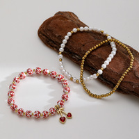 Ensemble de 3 bracelets et joncs personnalisables en perles plaquées or et cuivre, style bohème, avec breloque cœur floral rouge pour femme