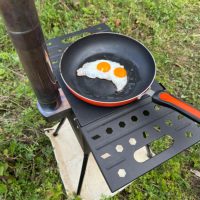 Poêle à bois en acier au carbone en gros, prix d'usine, poêle de camping pliable portable, équipement extérieur professionnel polyvalent