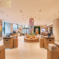 Meuble mural personnalisable en MDF ONI Shopfitting avec éclairage LED pour caisse, comptoir d'accueil, café, boulangerie, présentoir alimentaire