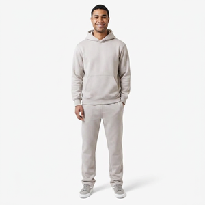 Trajes deportivos de invierno unisex personalizados, de algodón transpirable y forro polar, conjunto 2 en 1 con efecto lavado ácido, pantalones de chándal de pierna ancha y sudadera con capucha, de color liso y peso pesado. - Product Image 1