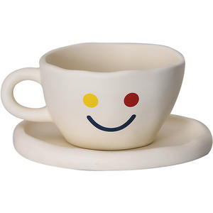 Taza y Platillo de Cerámica con Cara Divertida para Té, Café, Leche - Product Image 1