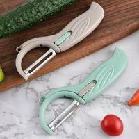 Multifunctionele handmatige vogelvormige roterende roestvrijstalen mesjes-schiller met creatief plastic handvat voor het schillen van groenten en fruit