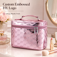 Sac cosmétique personnalisé en gros avec logo, finition métallique rose, motif gaufré, double fermeture éclair, trousse de maquillage portable