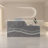 Comptoir de réception de luxe en forme de vague, réversible gauche-droite, avec bande LED pour hôtel et salon