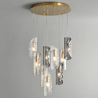 Lustre d'art moderne avec texture aléatoire de verre, acier inoxydable et hauteur réglable pour escalier, grenier, salon