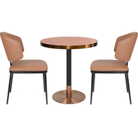 Table à manger ronde moderne et durable en pierre frittée avec bord en acier inoxydable or rose et base bicolore noire pour café/hôtel