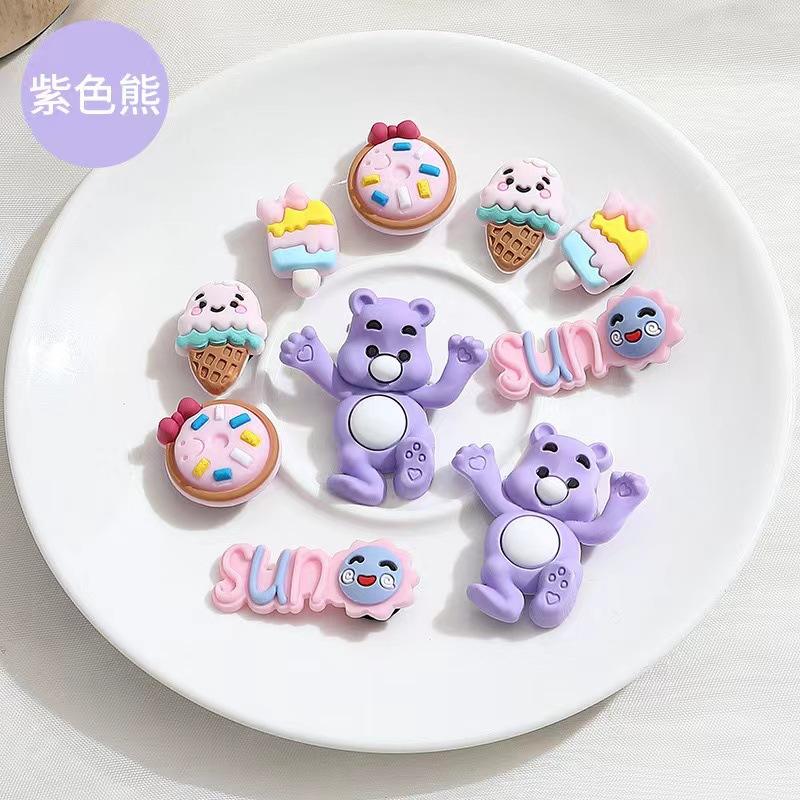 A set of purple bear accessories [including buttons]