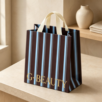 Sacs en papier kraft personnalisés avec poignées en coton, sacs de shopping en papier rayés en gros avec logo imprimé pour l'emballage de cadeaux de détail