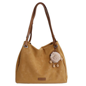 Brownish-<b>yellow</b> suede shoulder <b>bag</b> with a sweet, plush charm; women's handbag. - Product Image 1