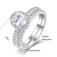 Fournisseur de bijoux haut de gamme QX, bague en or fin et argent sterling 925 avec pierre principale en forme de poire sertie d'un halo et de deux rangées de pierres fines