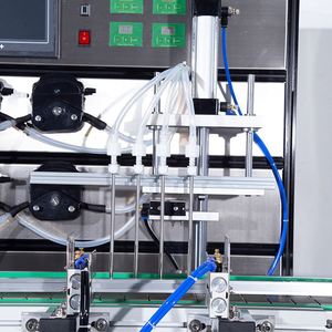 Machines de remplissage à 4 têtes pour pâte de sauce chili, shampoing, savon, bouteilles en plastique, jus d'orange, miel, parfum et boissons alcoolisées - Product Image 2
