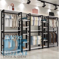 Présentoir de vêtements en métal/bois noir moderne, présentoir de vêtements pour hommes, pour magasin de mode, stand d'exposition de vêtements