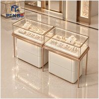 Table de présentation de bijoux avec vitrine en verre et pieds en acier inoxydable, comptoir d'îlot de vente au détail personnalisé