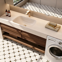Meuble-lavabo intégré sur mesure pour salle de bain et balcon avec espace pour machine à laver, vasque en pierre frittée courbée à chaud