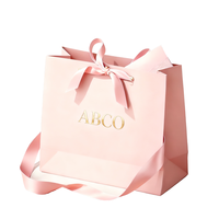 Emballage en papier d'art de luxe recyclable avec logo personnalisé, poignée torsadée classique, ruban rose, pour usage professionnel et commercial, impression offset