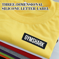 Étiquette en silicone personnalisée rectangulaire noire avec lettres blanches, lavable, durable, pour vêtements, logo de marque en caoutchouc
