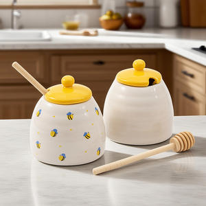 Tarro de miel de cerámica con tapa y cuchara, diseño de abeja blanca, contenedor redondo para almacenamiento de alimentos para uso en la cocina. - Product Image 1