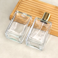 Flacon de parfum carré en verre personnalisé de qualité supérieure 100 ml avec pompe pulvérisatrice dorée ou argentée, contenant rectangulaire transparent vide pour produits de luxe