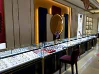Vitrine personnalisée de bijoux en métal de Delux montre de luxe en or armoire en bois claire à LED boutique de luxe en verre vitrine