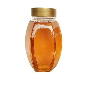 Barato al por mayor 730ml 1kg forma hexagonal miel frascos de vidrio con tapas