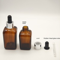 Flacon compte-gouttes carré en verre ambré vide de 10 ml avec anneau doré et bulbe en caoutchouc noir, pour huiles essentielles et cosmétiques, opaque, vente en gros