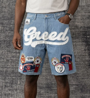 DENIMGUYS Short en jean pour homme, style européen et américain, été, personnalisé, effet vieilli, avec broderies, patchs et appliques, et surpiqûres en zigzag