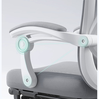 Chaise de bureau ergonomique à dossier ouvert en maille respirante avec appui-tête réglable, accoudoirs rabattables et repose-pieds rétractables